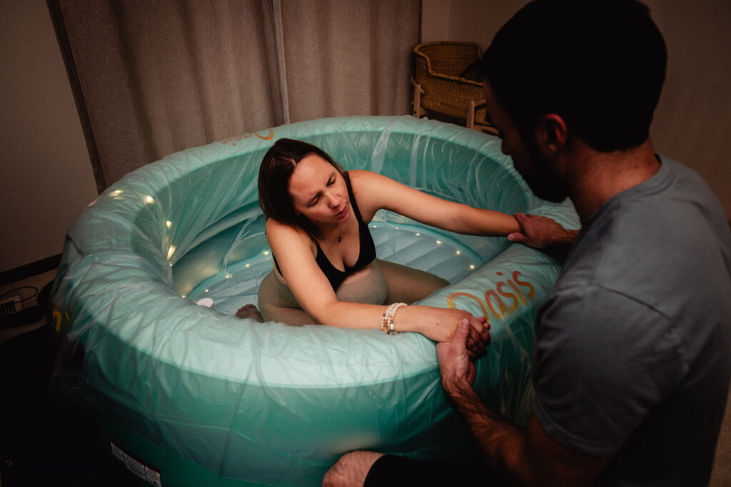 Mothering laboring in birth pool at home water birth