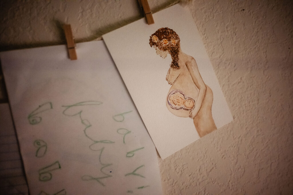 Watercolor pregnancy painting and birth affirmations for labor space