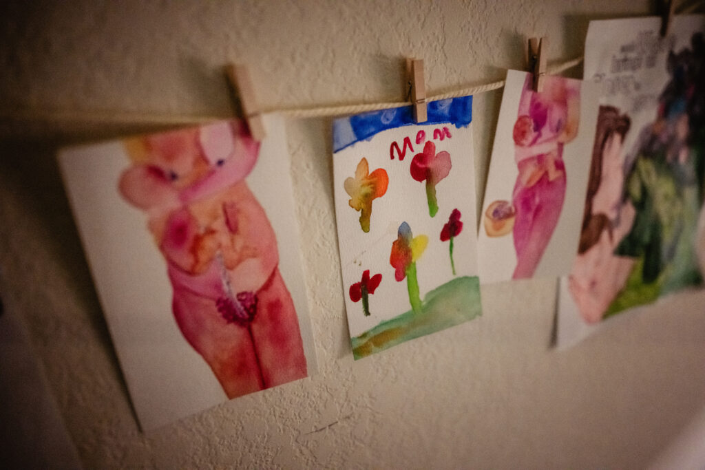 Painted birth affirmations and drawings hanging in birth space