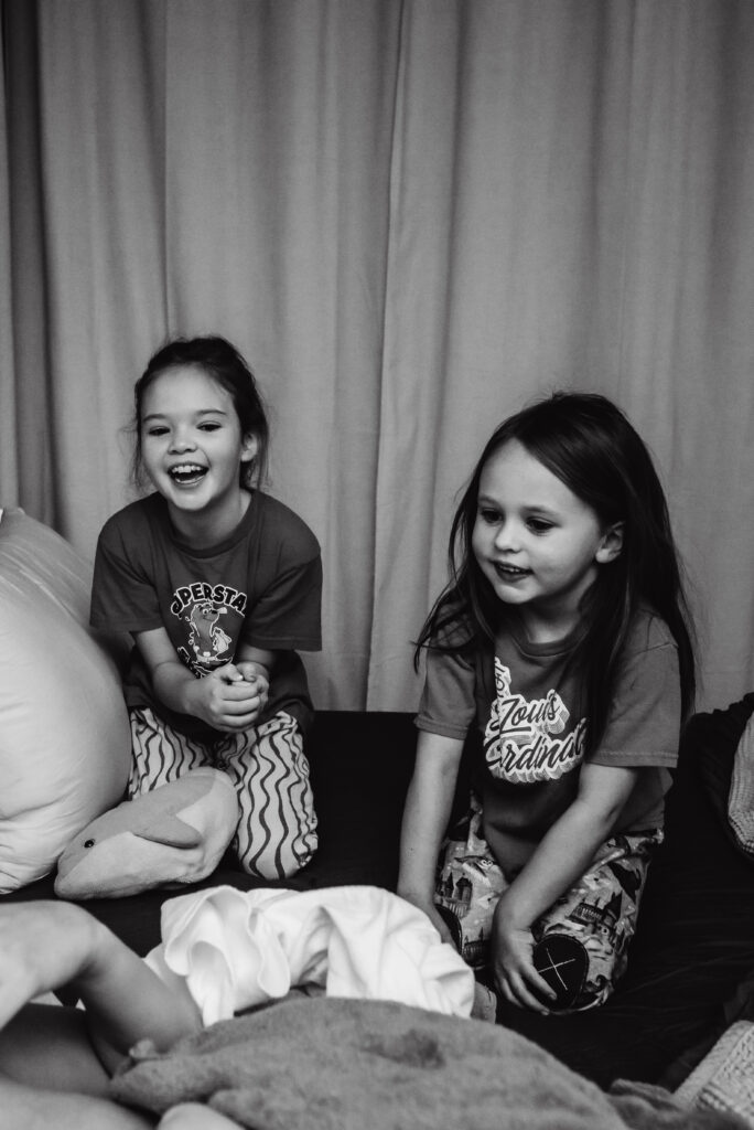 Siblings meeting their newborn sister